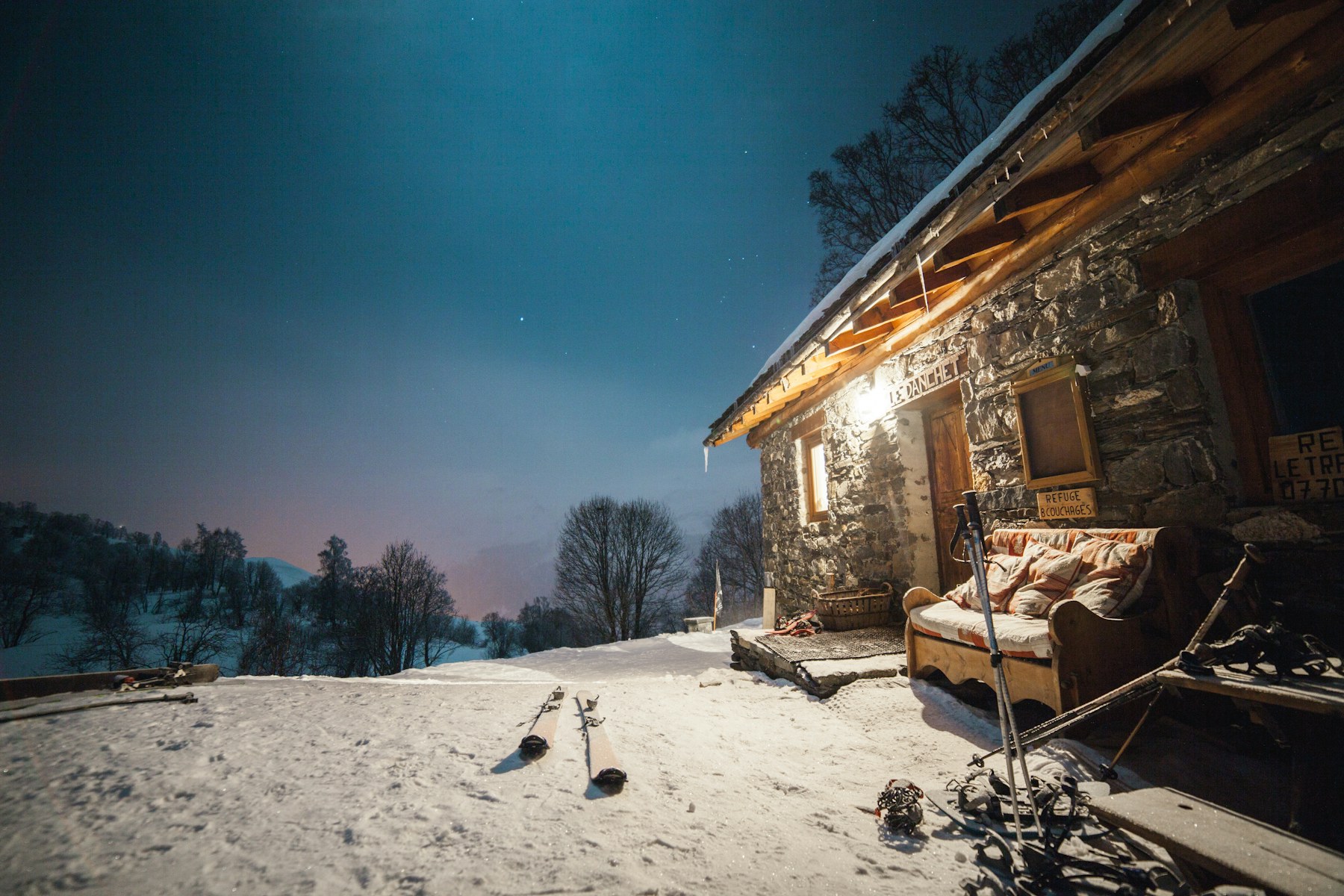 A chalet door at night
