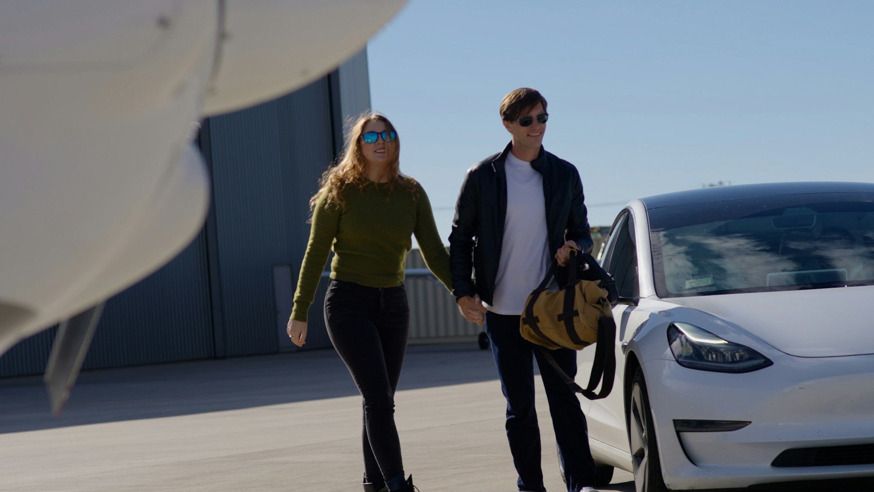Couple walking to the jet