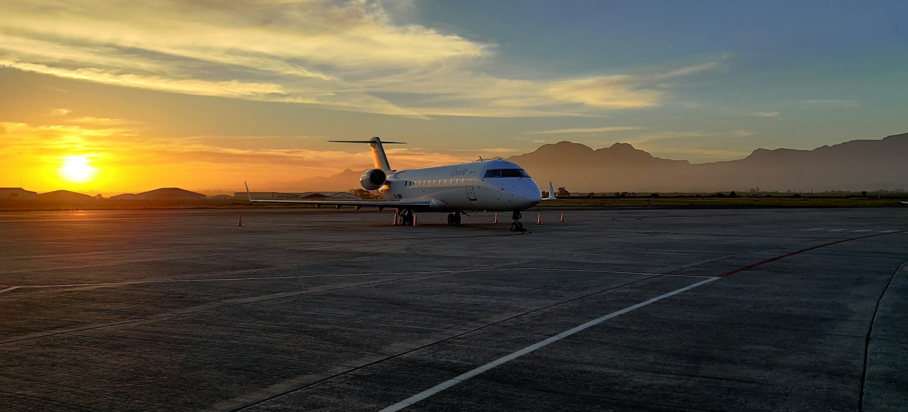 Private jet on the apron at sunset
