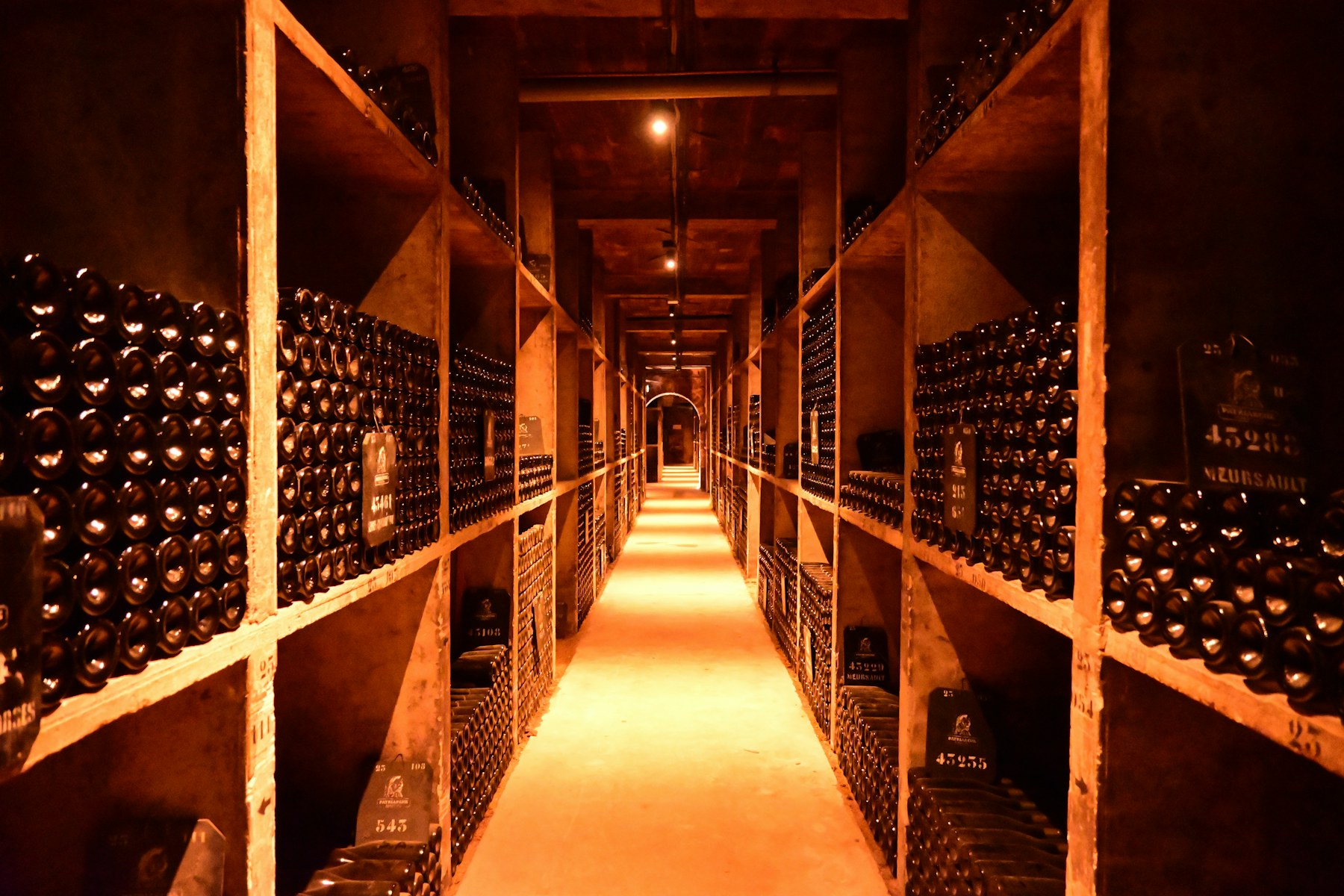The members’ cellar, lit by candles