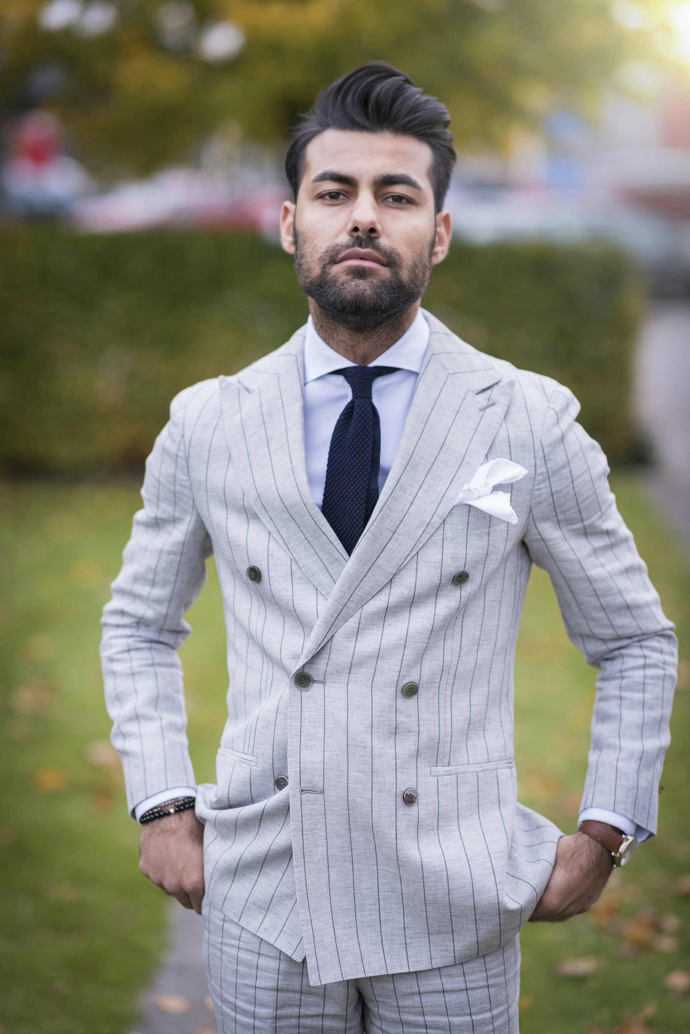 Client in a pale grey double-breasted chalk-stripe suit
