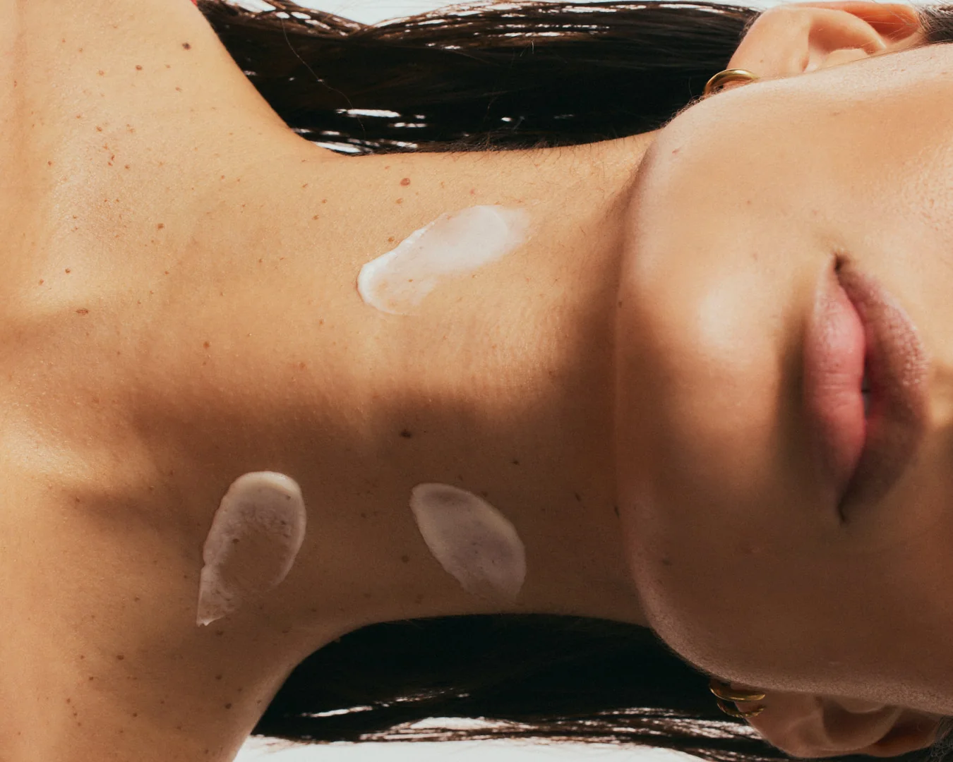 Serum smoothed across the neck and décolleté
