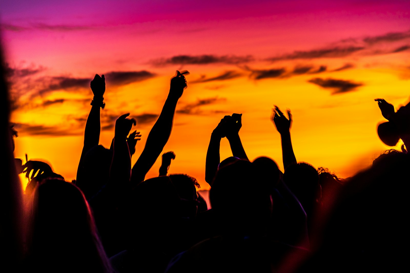 Hands up at sunset