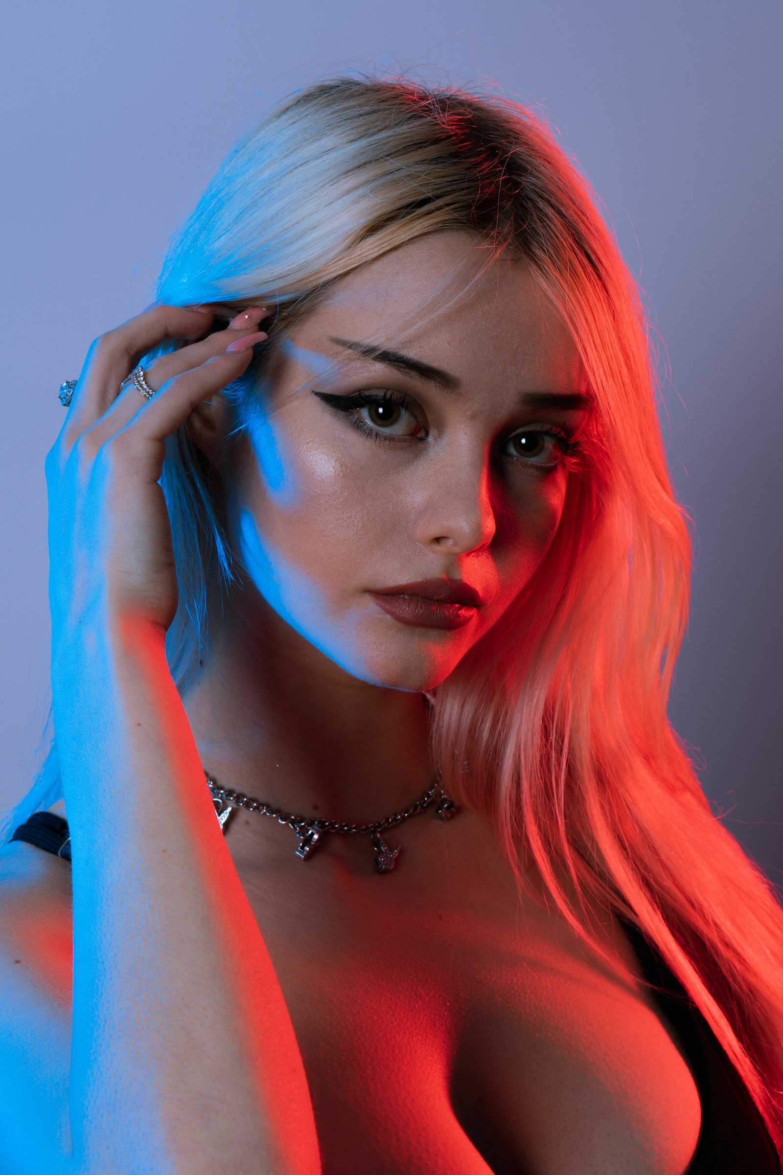 Woman in pink and blue neon light