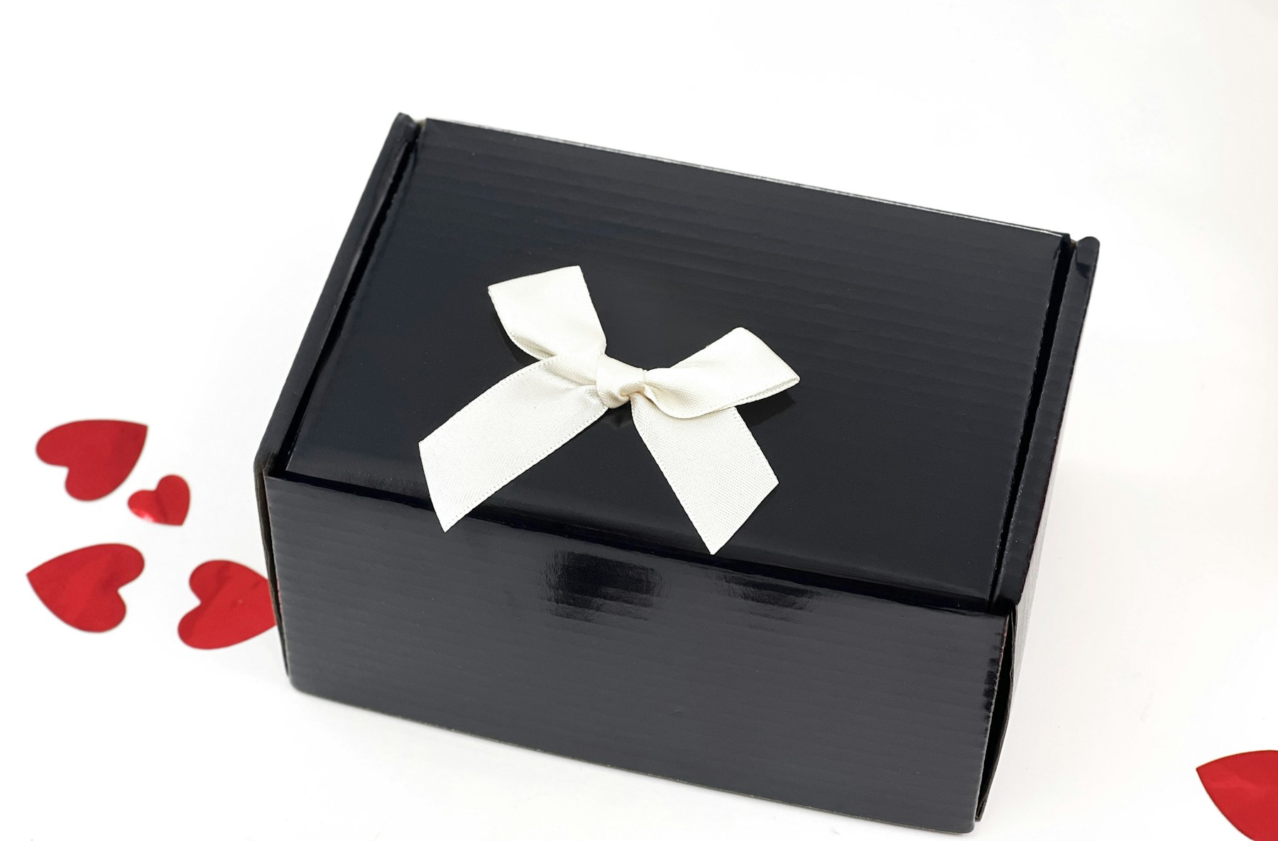 Black gift box with a wax seal