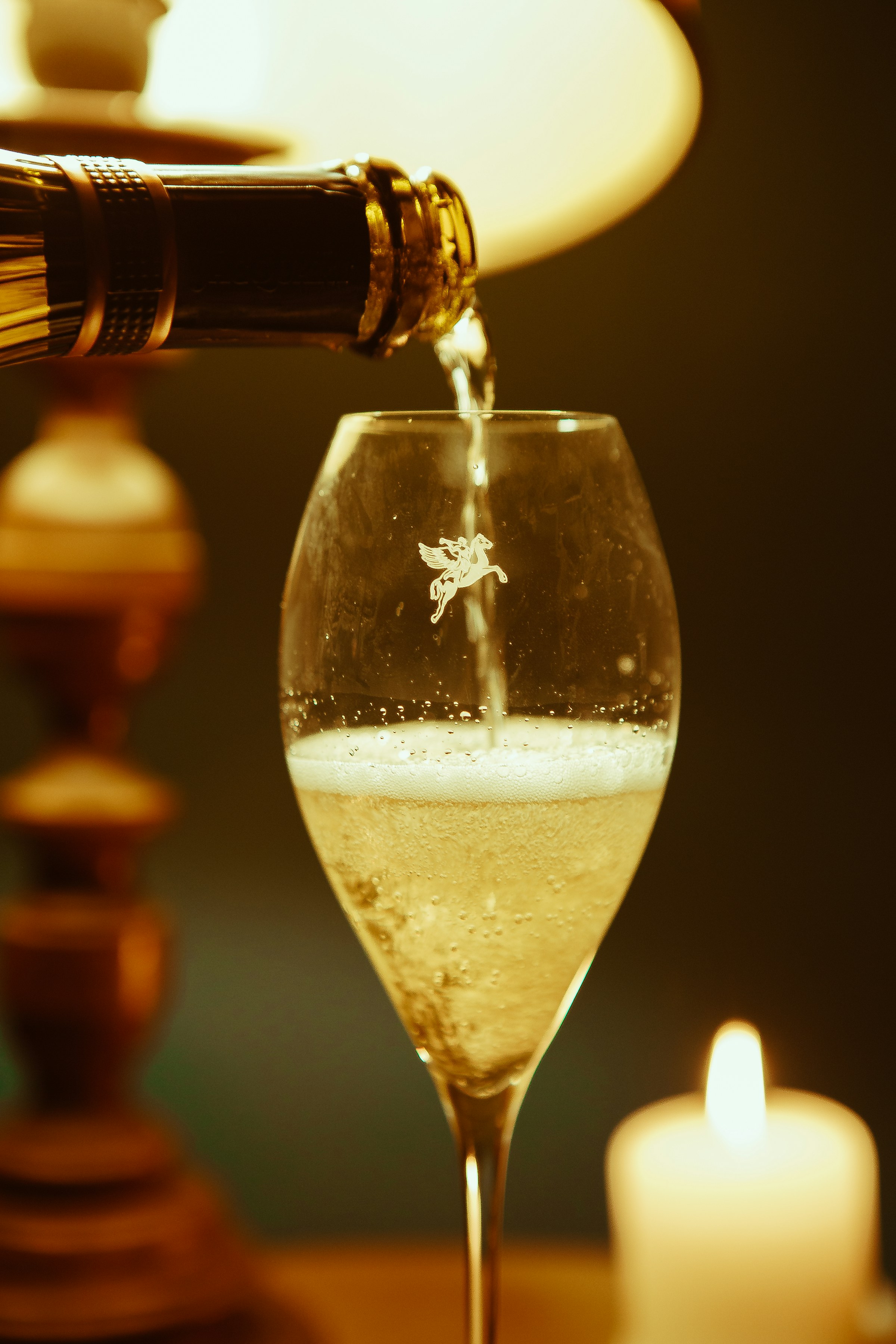 Champagne poured by candlelight