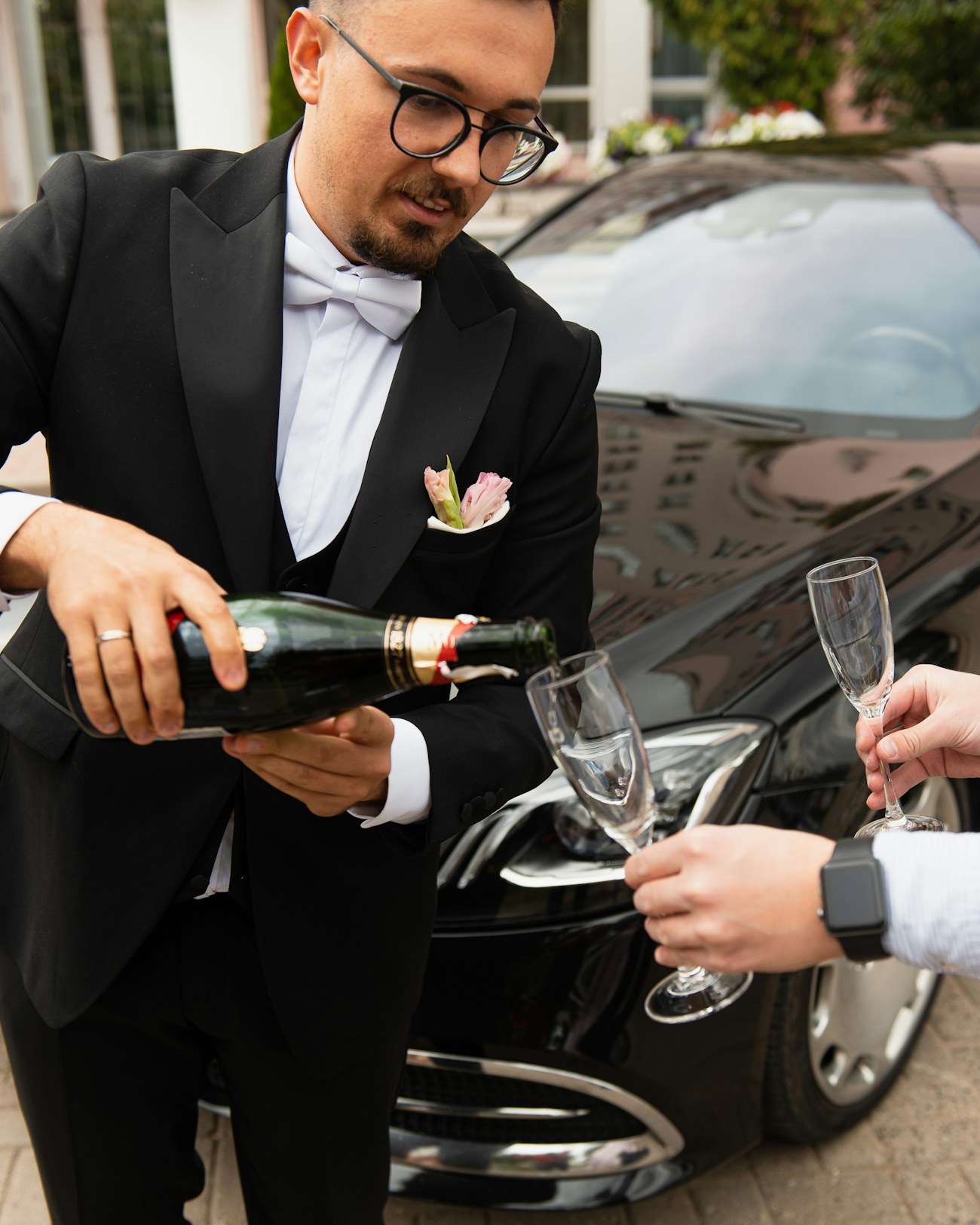 Host pouring champagne