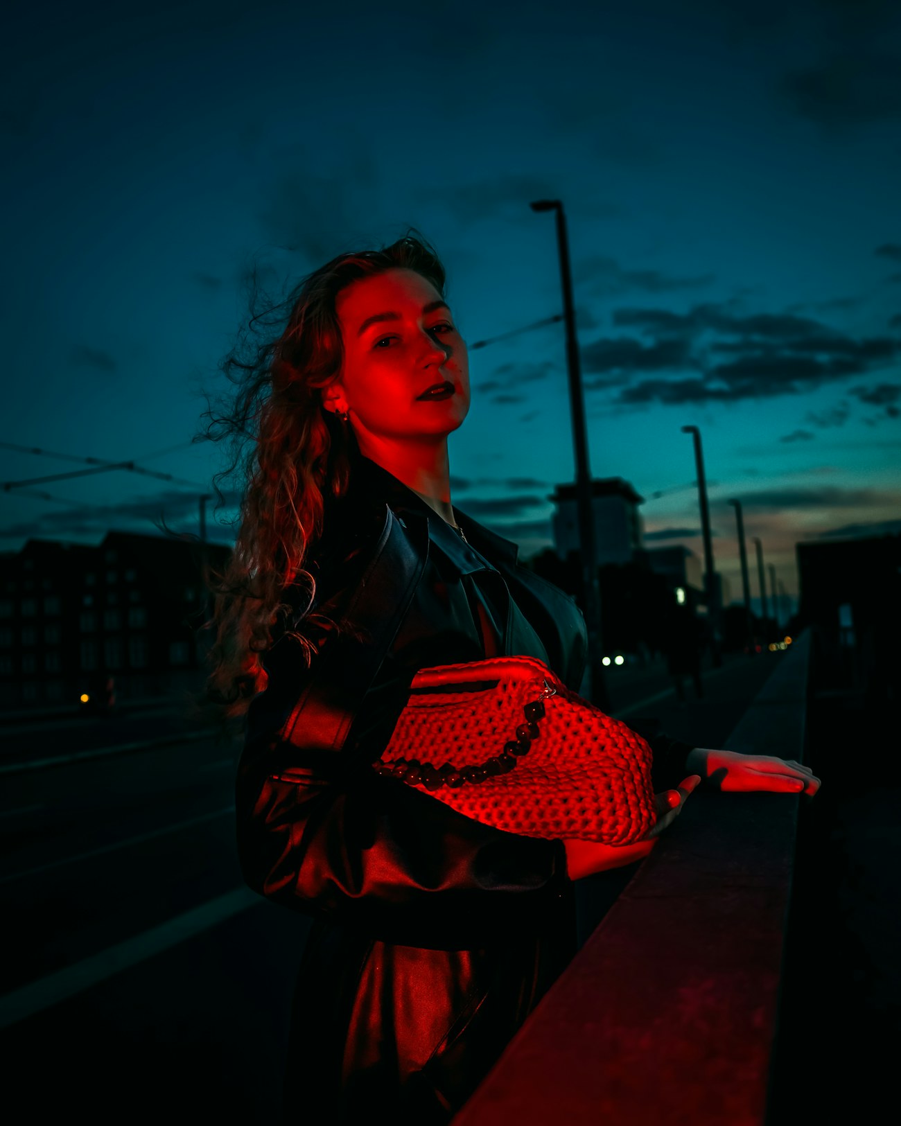 A woman carrying a VELLUM bag